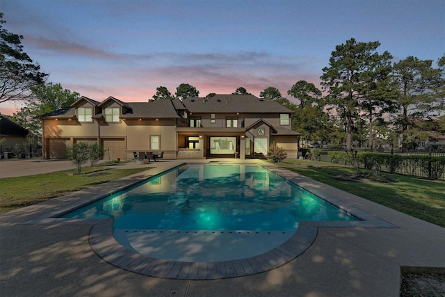 view of swimming pool with a patio, fence, a fenced in pool, and a lawn