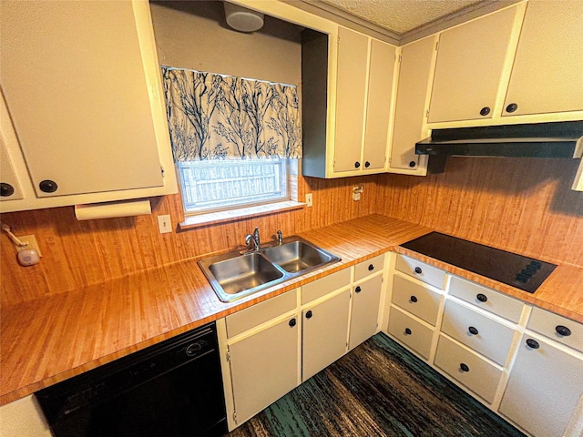 kitchen featuring black appliances, light countertops, under cabinet range hood, and a sink