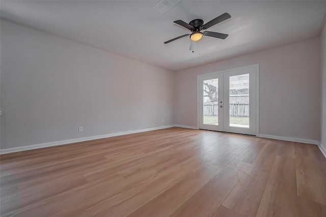 unfurnished room featuring visible vents, french doors, light wood-style floors, baseboards, and ceiling fan