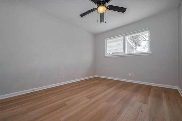 unfurnished room with light wood-type flooring, baseboards, and ceiling fan