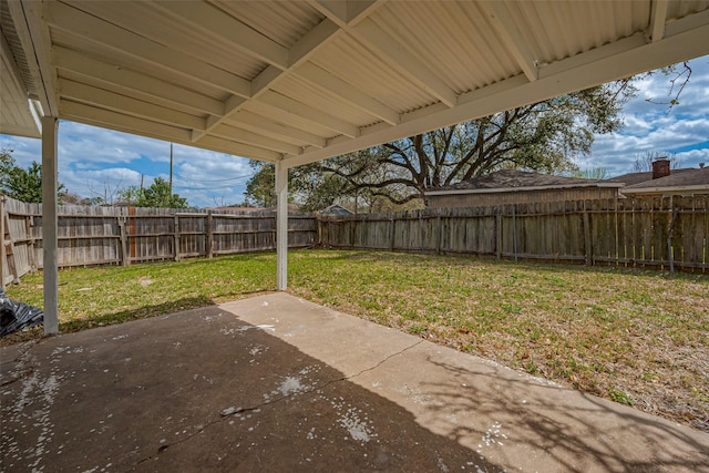 view of yard with a patio area and a fenced backyard