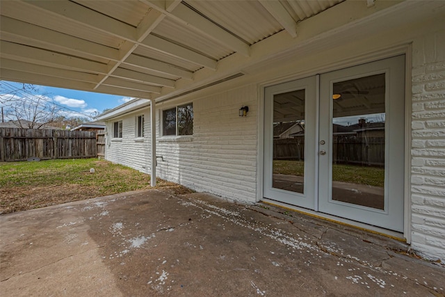 view of patio / terrace with french doors and fence