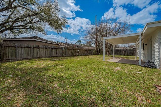 view of yard featuring a patio area and a fenced backyard