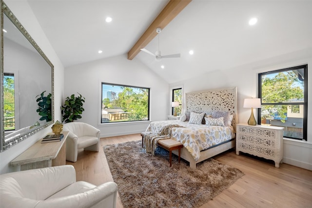 bedroom featuring light wood finished floors, recessed lighting, multiple windows, and vaulted ceiling with beams