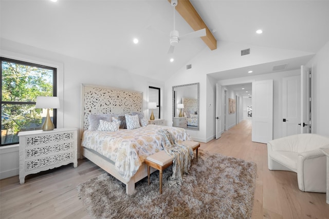 bedroom featuring beam ceiling, visible vents, high vaulted ceiling, and light wood-style floors