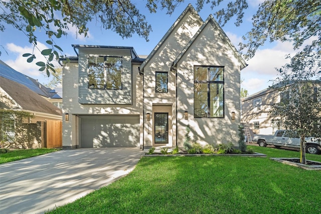 view of front facade with driveway, a front lawn, and a garage