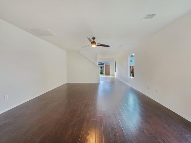 unfurnished living room featuring wood finished floors, visible vents, and ceiling fan