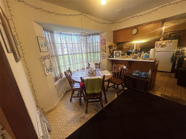 dining area featuring baseboards