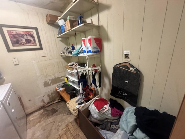 clothes washing area featuring washer and dryer and laundry area