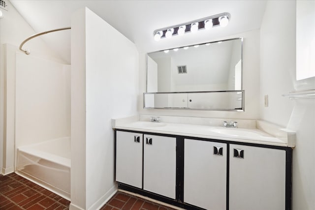 bathroom featuring visible vents, double vanity,  shower combination, brick floor, and a sink