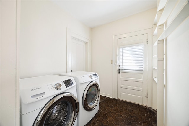 laundry room with laundry area and washing machine and clothes dryer