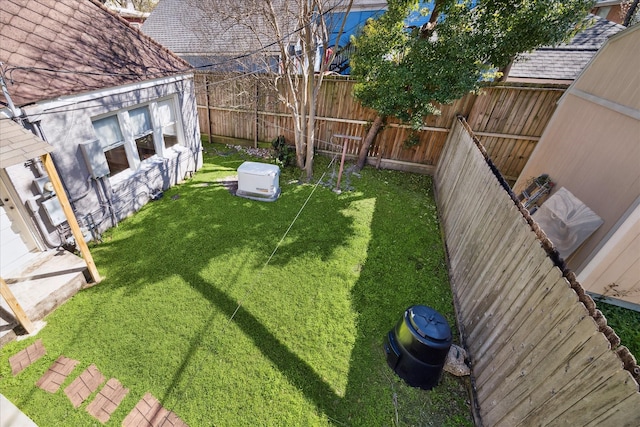 view of yard featuring a fenced backyard