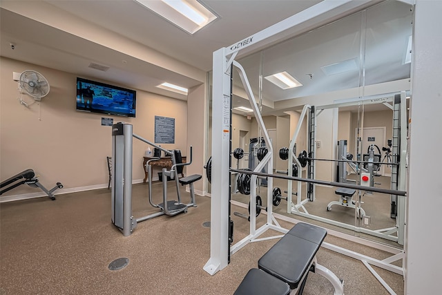 workout area with visible vents and baseboards