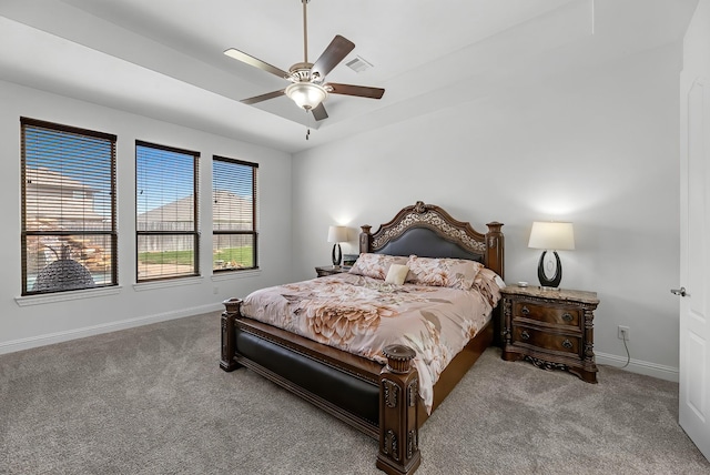 bedroom featuring visible vents, baseboards, ceiling fan, and carpet flooring