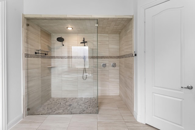 bathroom with tiled shower