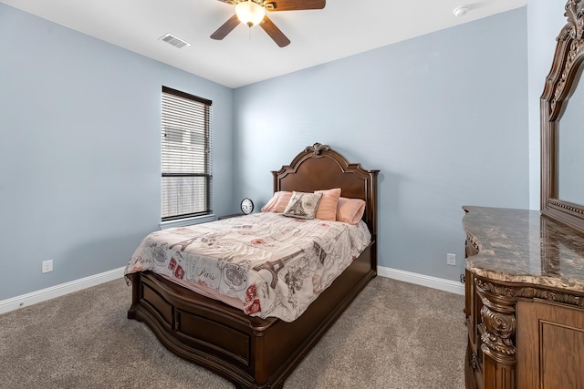 carpeted bedroom featuring visible vents, ceiling fan, and baseboards