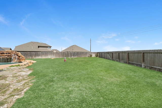 view of yard featuring a fenced backyard