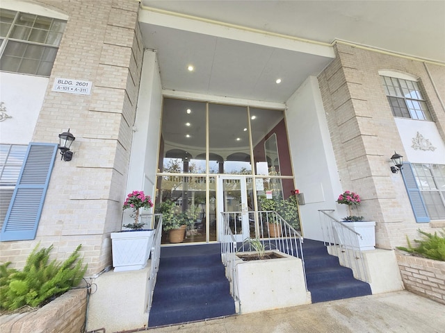 entrance to property with brick siding