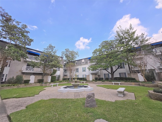 view of home's community with a lawn