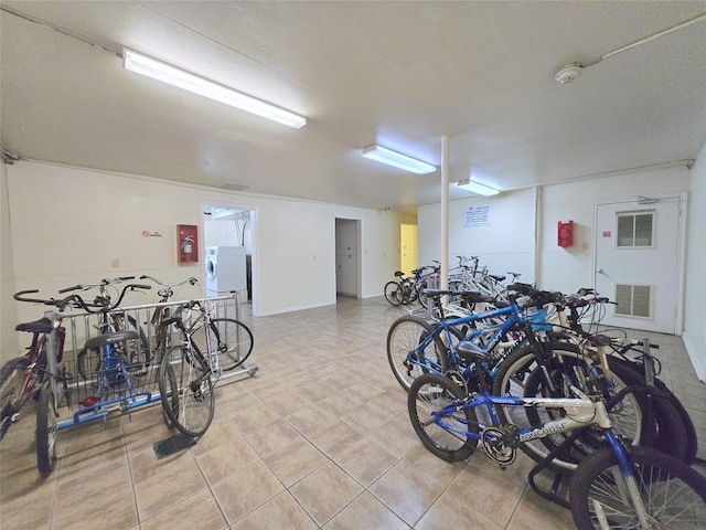 garage with washer / dryer, bike storage, and visible vents