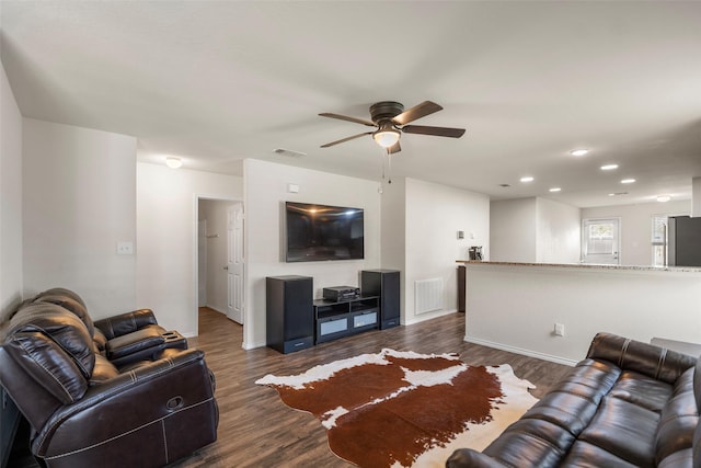 living room featuring dark wood-type flooring, recessed lighting, a ceiling fan, and visible vents