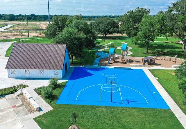 exterior space featuring a yard, a barn, and playground community