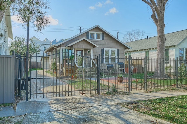 view of front of home featuring a fenced front yard and a gate