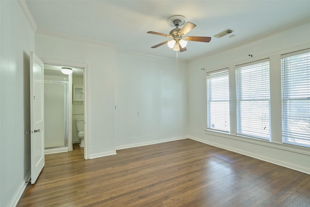 unfurnished bedroom with visible vents, ornamental molding, dark wood-style floors, baseboards, and ceiling fan