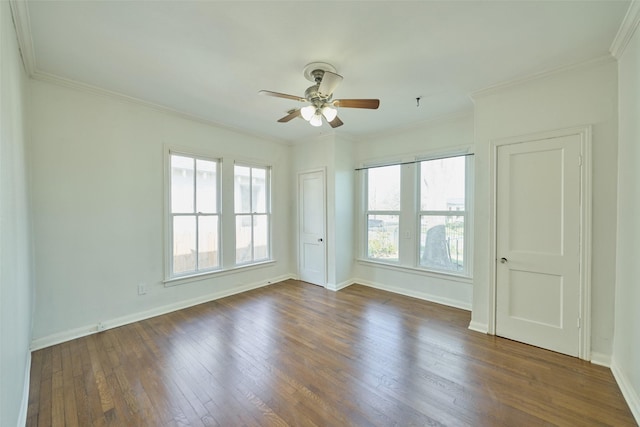 spare room with crown molding, a ceiling fan, and wood finished floors