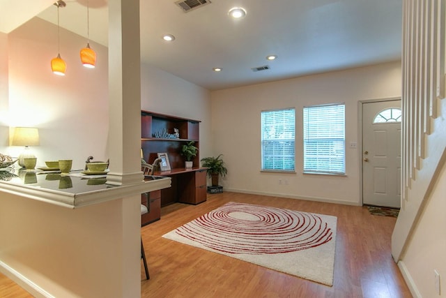 foyer featuring visible vents, recessed lighting, stairway, and wood finished floors