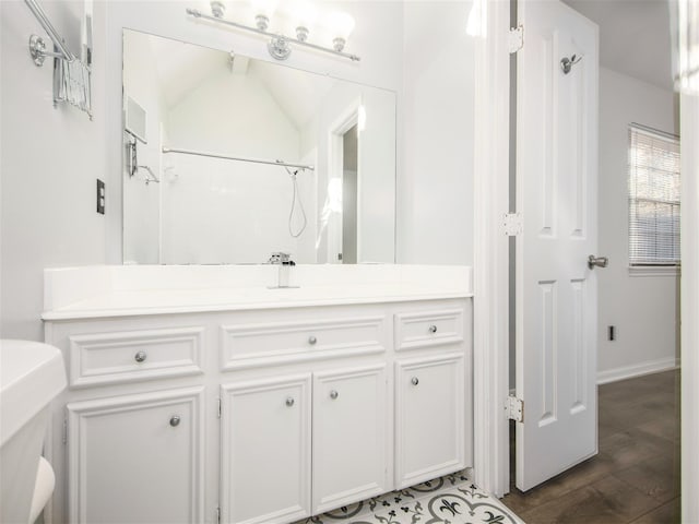 full bathroom with vanity and wood finished floors