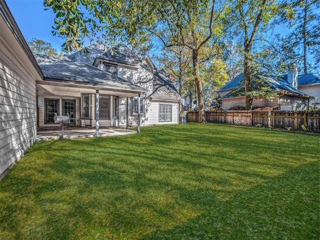 view of yard featuring a patio area and fence