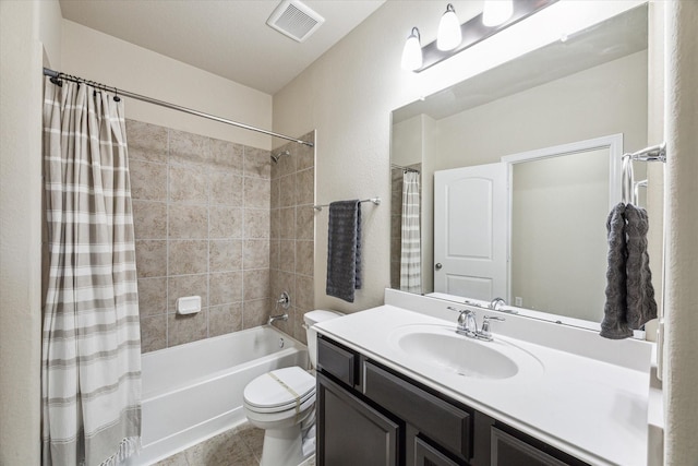 full bathroom with tile patterned floors, visible vents, shower / bath combo with shower curtain, toilet, and vanity