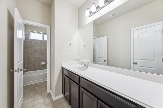 full bath with tub / shower combination, visible vents, baseboards, and vanity