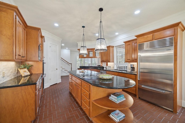 kitchen with ornamental molding, open shelves, a kitchen island, recessed lighting, and appliances with stainless steel finishes