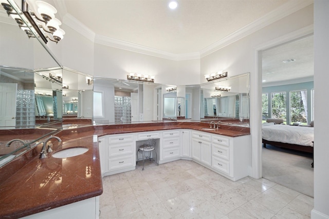 ensuite bathroom with visible vents, ensuite bathroom, an inviting chandelier, crown molding, and vanity