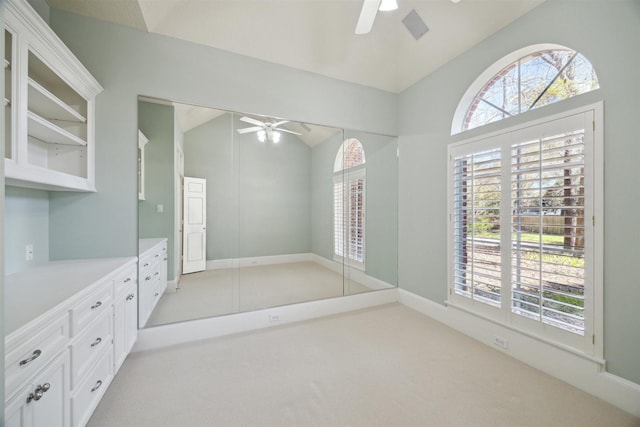 bathroom featuring vanity, lofted ceiling, and ceiling fan