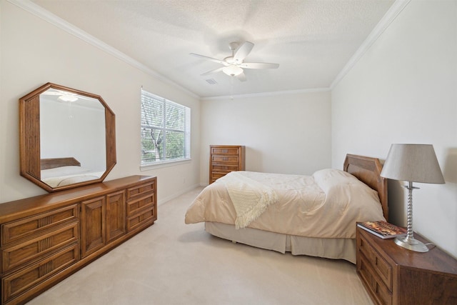 bedroom featuring ceiling fan, crown molding, light colored carpet, and a textured ceiling