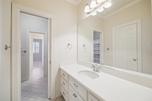 full bath with vanity, baseboards, tile patterned flooring, and ornamental molding