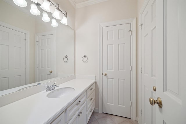 bathroom with tile patterned floors, vanity, and crown molding