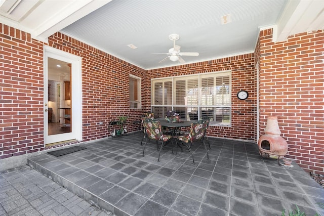 view of patio / terrace featuring outdoor dining area and a ceiling fan