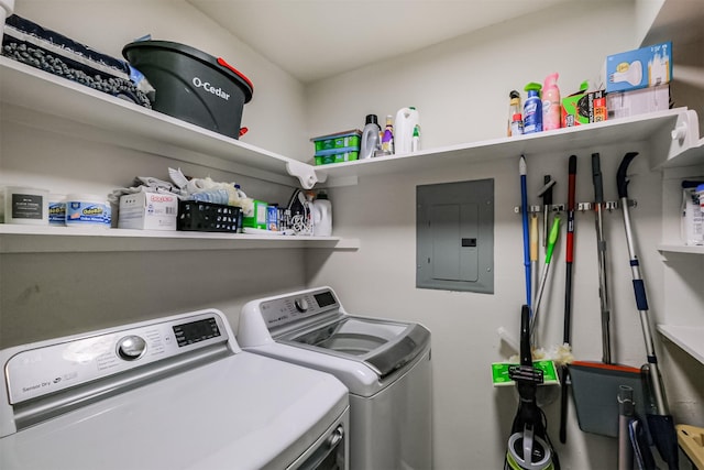 laundry area featuring laundry area, electric panel, and independent washer and dryer