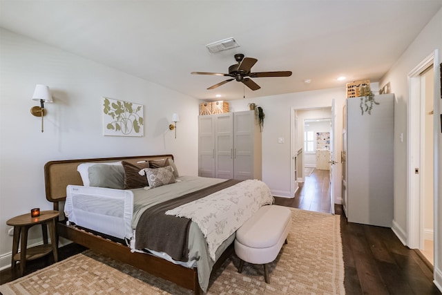 bedroom with visible vents, a ceiling fan, dark wood finished floors, recessed lighting, and baseboards