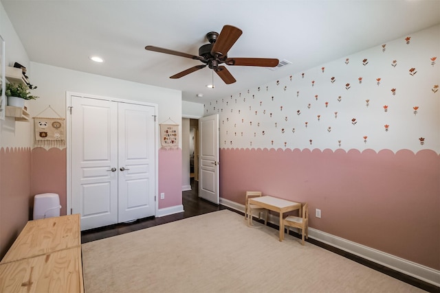 unfurnished bedroom with visible vents, baseboards, wallpapered walls, recessed lighting, and a closet