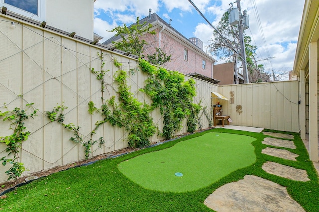 view of yard with a fenced backyard