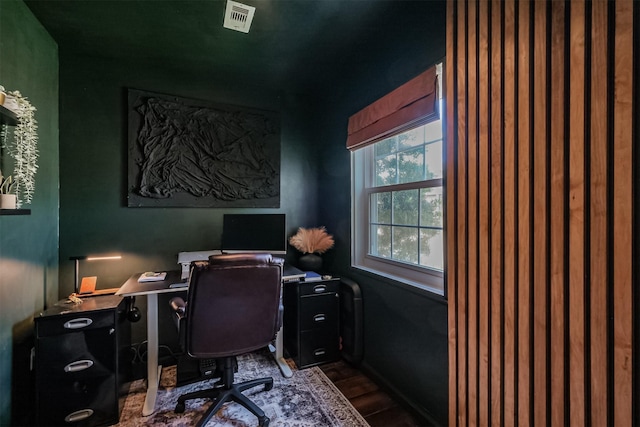 office featuring visible vents and dark wood-type flooring