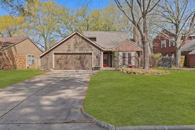 view of front of property with a front yard, roof with shingles, concrete driveway, and an attached garage