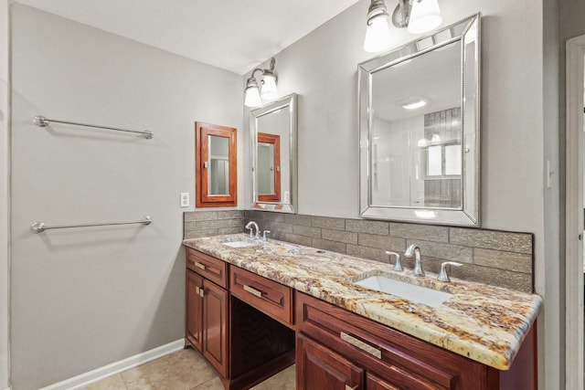 full bath featuring tile patterned flooring, decorative backsplash, double vanity, and a sink