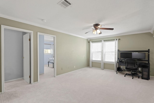 carpeted home office with visible vents, baseboards, crown molding, and ceiling fan