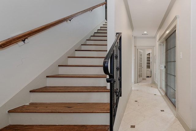 stairs featuring french doors